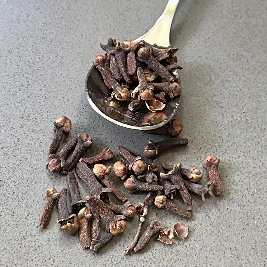 Whole cloves on a spoon