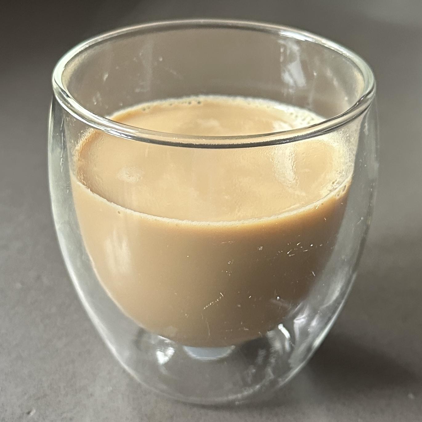 Macro pour — 8 oz masala chai in a double-wall glass